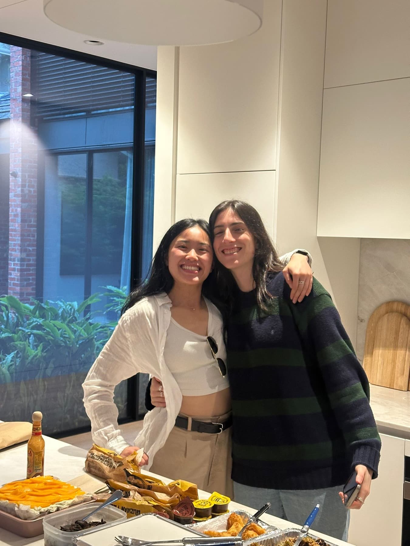 Cara and Cindy smiling together at an Inspector Byte dinner